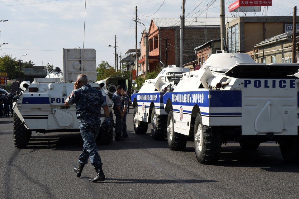  Policemen block a street after a group of armed men seized a police station along with an unknown number of hostages, according the country's security service, in Yerevan, Armenia