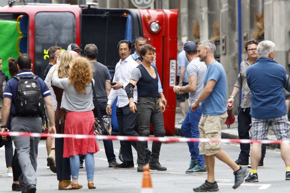 Tom Cruise Climbing Out Of A London Bus While Filming The Mummy