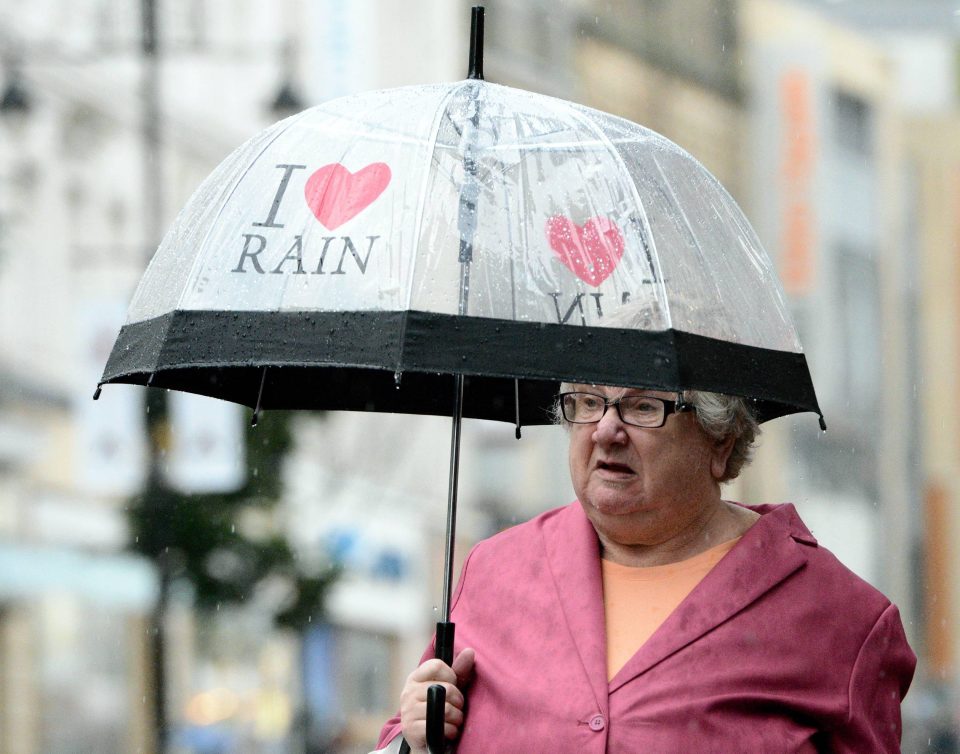 Shoppers caught in heavy rain while walking in Newcastle today as the north has been deluged with thunderstorms