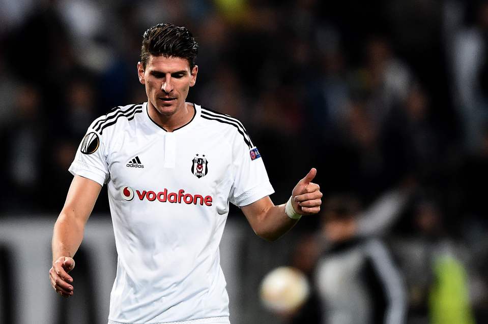 (FILES) This file photo taken on October 1, 2015 shows Besiktas' German forward Mario Gomez gestureing during the UEFA Europa League group H football match between Besiktas Istanbul and Sporting CP at the Ataturk Olimpiyat Stadium in Istanbul. German striker Mario Gomez, the top scorer in Turkey's Super Lig last season, on July 20, 2016 said he was leaving Istanbul club Besiktas after just one season due to the political situation in the wake of the failed coup. / AFP PHOTO / OZAN KOSEOZAN KOSE/AFP/Getty Images