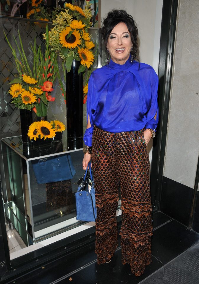 She flashed her bra underneath a sheer blue blouse