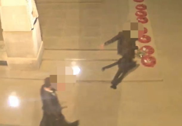 The man approaches the poppy wreath with his leg arched back