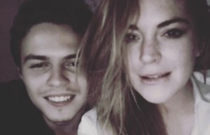 Lindsay Lohan slams fiance for 'cheating with hooker' before hinting she's having a baby