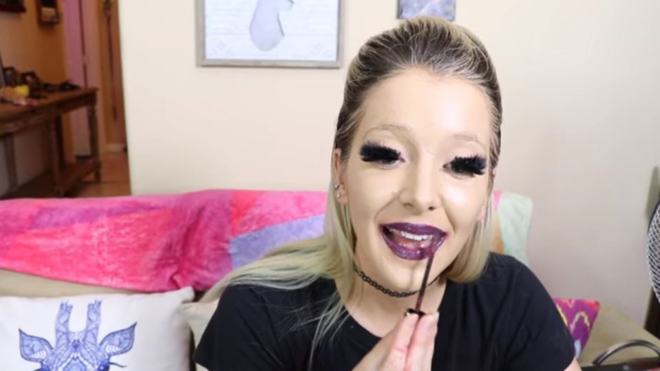 She smothers her lips in liquid lipstick so thick, she has to dry each layer with a hair dryer