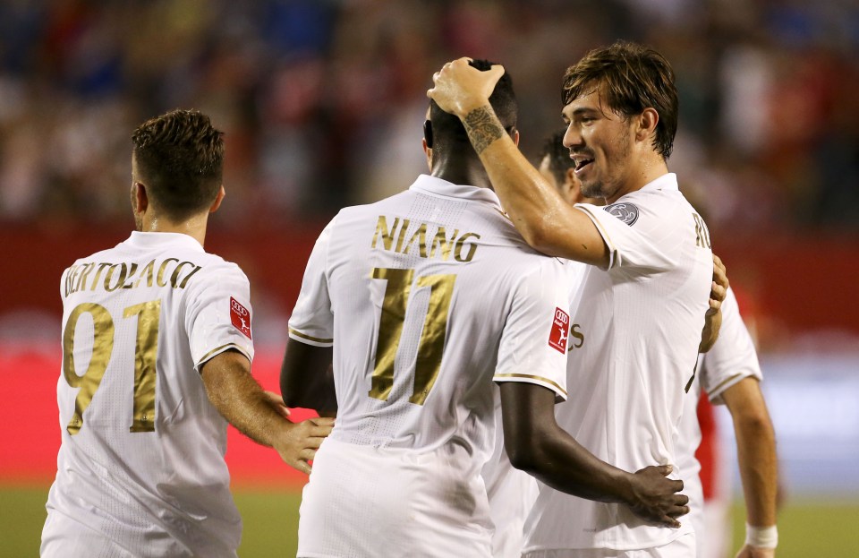 Niang is congratulated after his goal in the first half for AC Milan