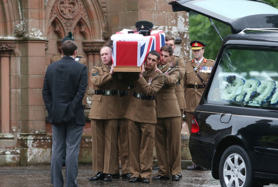 Soldiers carry the coffin of Corporal Josh Hoole from the memorial centre
