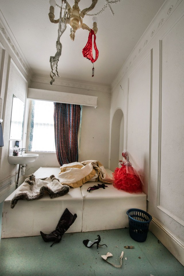 Discarded underwear hang from the lights and kinky boots are left on the floor