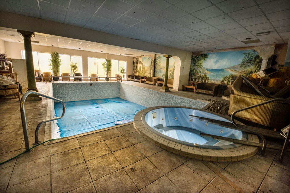 The swimming pool area features an eight person jacuzzi