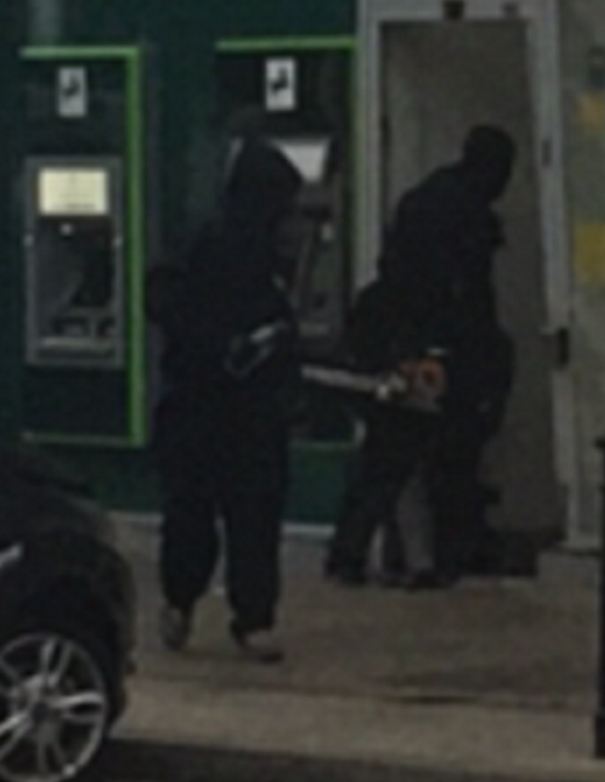 It's thought there were six robbers involved - one of whom lobbed an object into the car, starting the fire