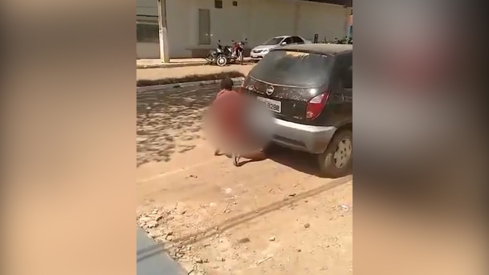 The horny hatchback-humper carries on copulating with the car until he realises he is being filmed 