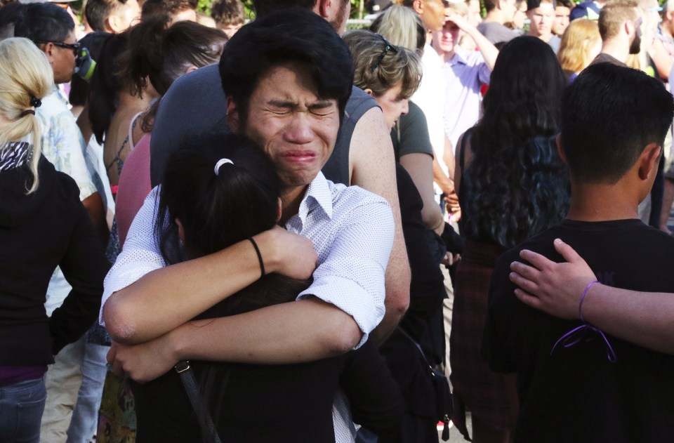 Devastated friends and family hugged at the scene