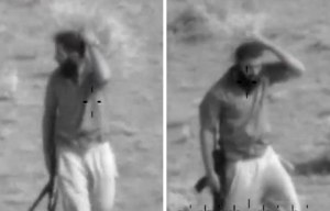 ISIS fighter attemnpts to camouflage himself from helicopter with a BUSH