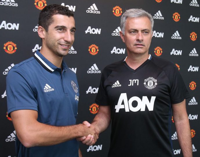 MANCHESTER, ENGLAND - JULY 06: (EXCLUSIVE COVERAGE) Henrikh Mkhitaryan of Manchester United poses with Manager Jose Mourinho after signing for the club at Aon Training Complex on July 6, 2016 in Manchester, England. (Photo by Matthew Peters/Man Utd via Getty Images)