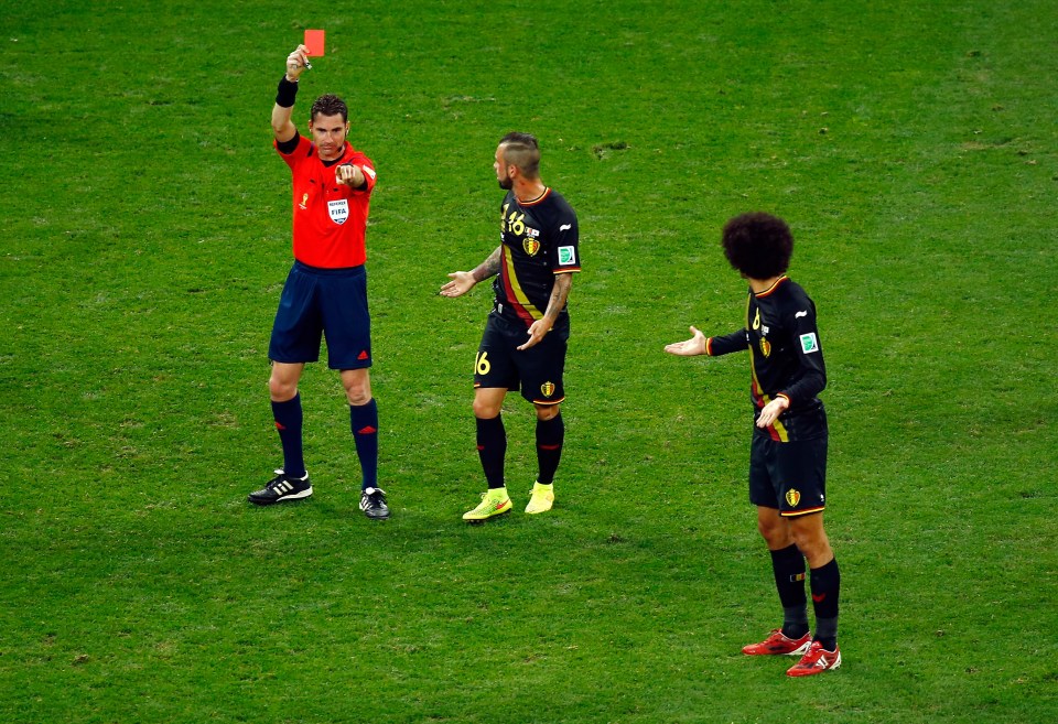 SAO PAULO, BRAZIL - JUNE 26: Steven Defour and Marouane Fellaini of Belgium protest to referee Benjamin Williams as he shows a red card to Defour during the 2014 FIFA World Cup Brazil Group H match between South Korea and Belgium at Arena de Sao Paulo on June 26, 2014 in Sao Paulo, Brazil. (Photo by Matthew Lewis/Getty Images)