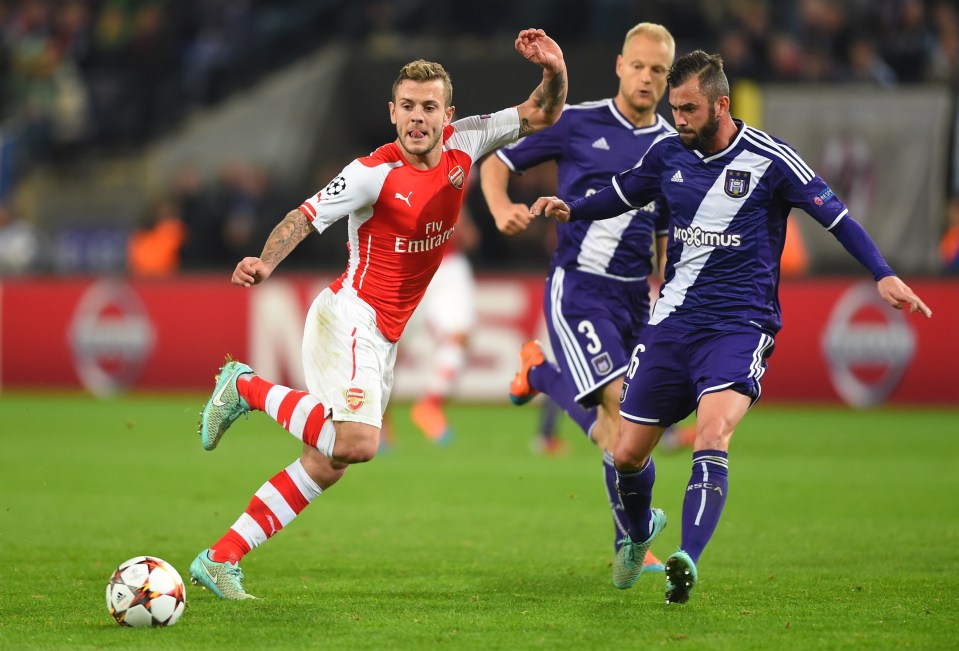 Arsenal's English midfielder Jack Wilshere (L) vies with Anderlecht's midfielder Steven Defour during a UEFA Champions League group stage football match Anderlecht vs Arsenal at the Constant Vanden Stock stadium in Anderlecht on October 22, 2014. AFP PHOTO / EMMANUEL DUNAND (Photo credit should read EMMANUEL DUNAND/AFP/Getty Images)