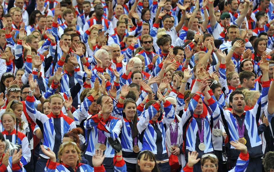 Athletes wave to the crowd during the 2012 parade
