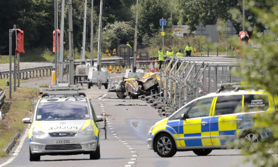 Crash site . . . police investigate horror scenes after crash on A27