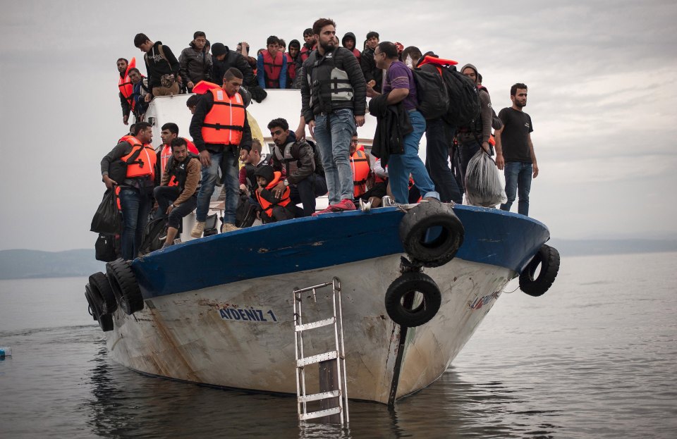 File photo of migrants and refugees arrive at the Greek island of Lesbos