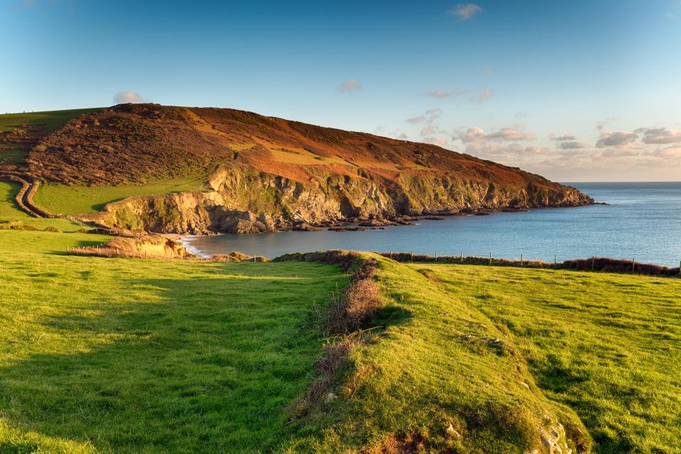 The south west coast path as it passes Hemmick Beach from Gorran Haven