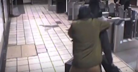 Mr Zimmerman is pictured being grabbed by Mire during the attack