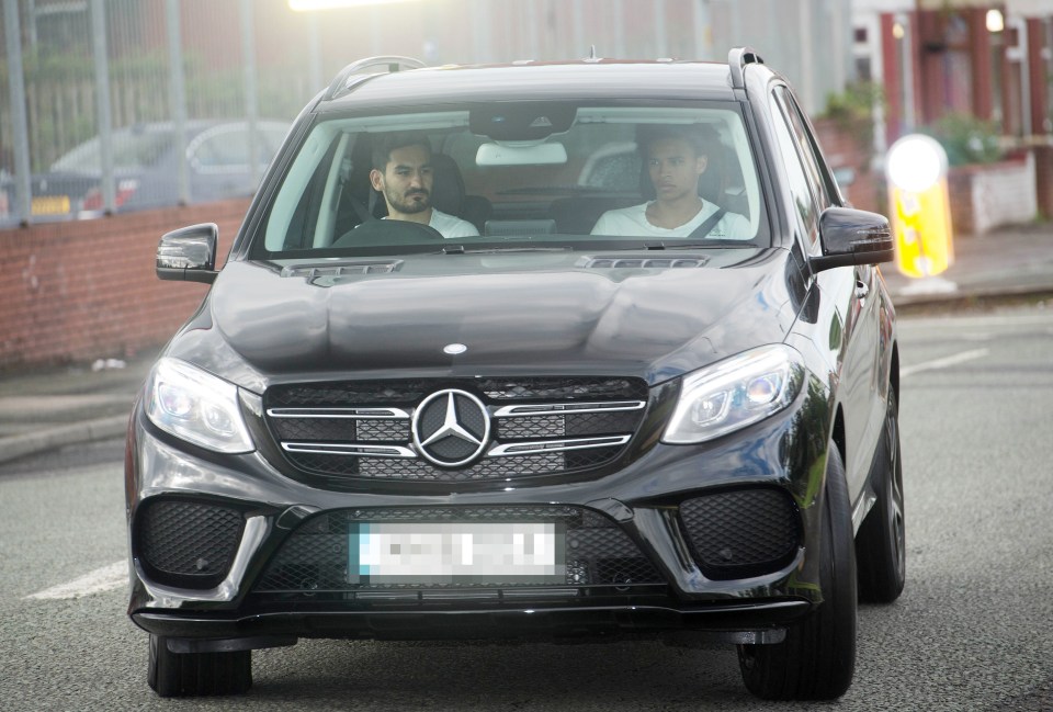 Ilkay Gundogan drives Leroy Sane to his first Manchester City training session