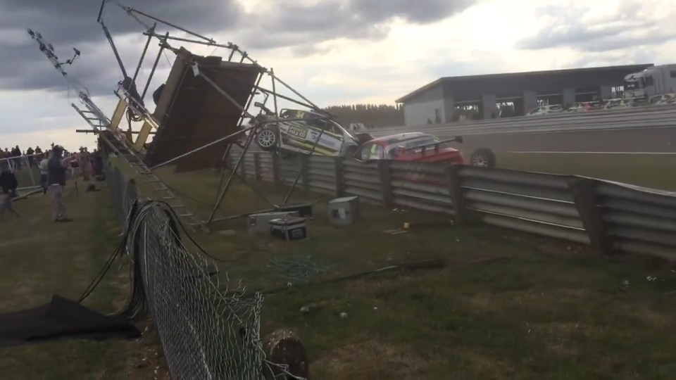 The tower collapses, sending the cameraman plummeting to the ground