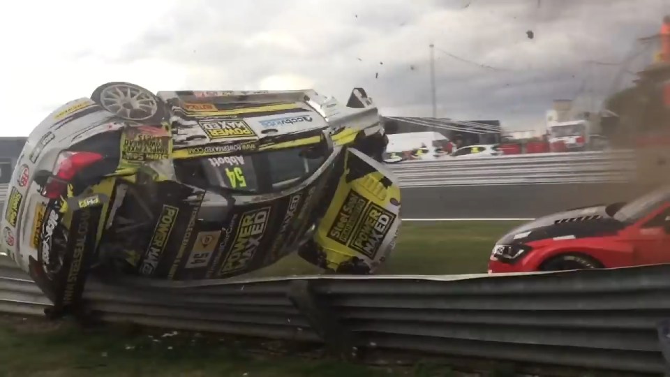 The crash barrier manages to prevent it smashing into spectators