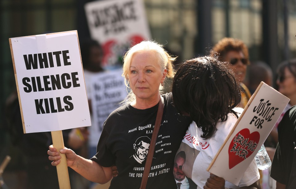 Mark Duggan's aunt Carole Duggan (left) with protesters marching from Broadwater Farm to Tottenham police station