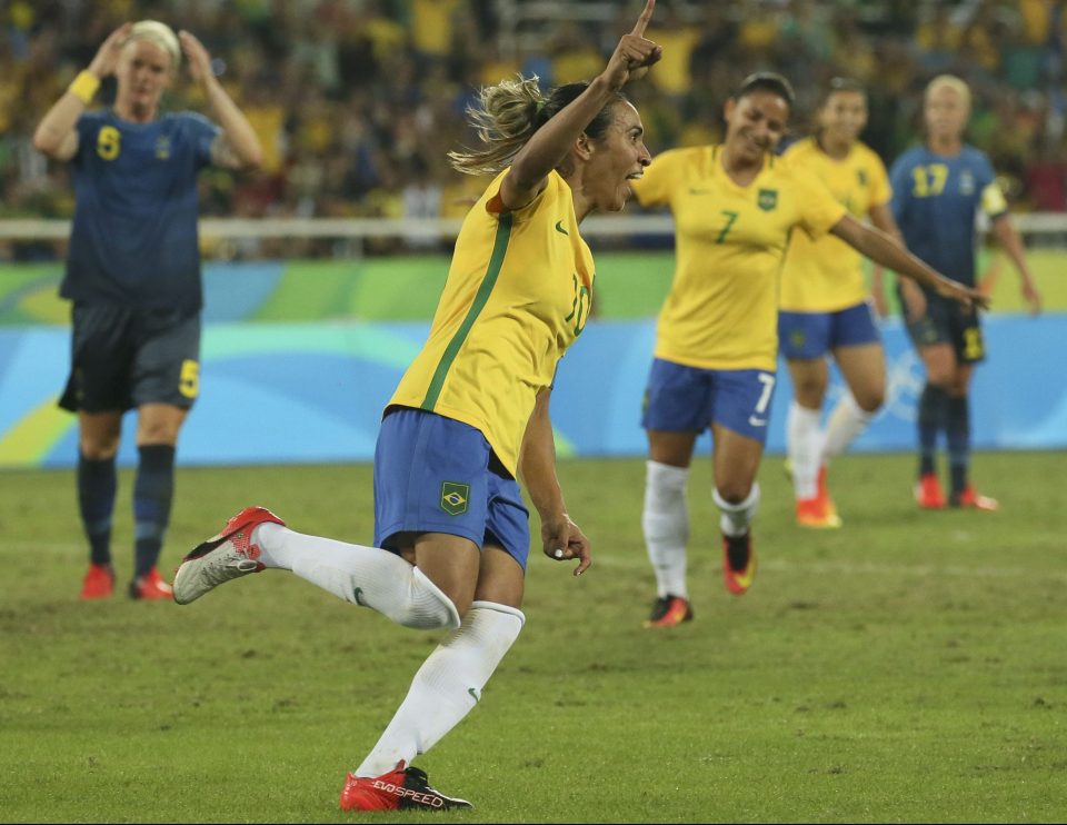 Marta wheels away in celebration after scoring Brazils fourth goal