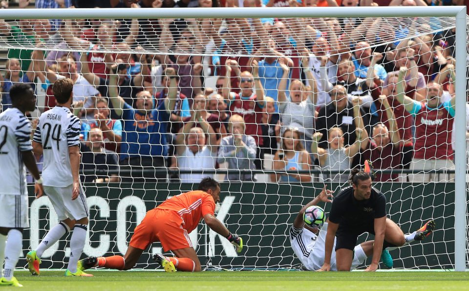 Andy Carroll scores his side's first goal