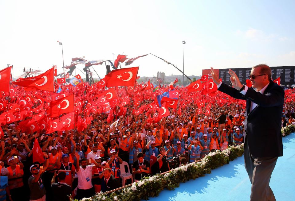 The president waved to the thousands of people in the crowd who were adorned in red and white