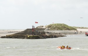 Teenagers missing after beach swim as man is also feared dead after he's swept out to sea