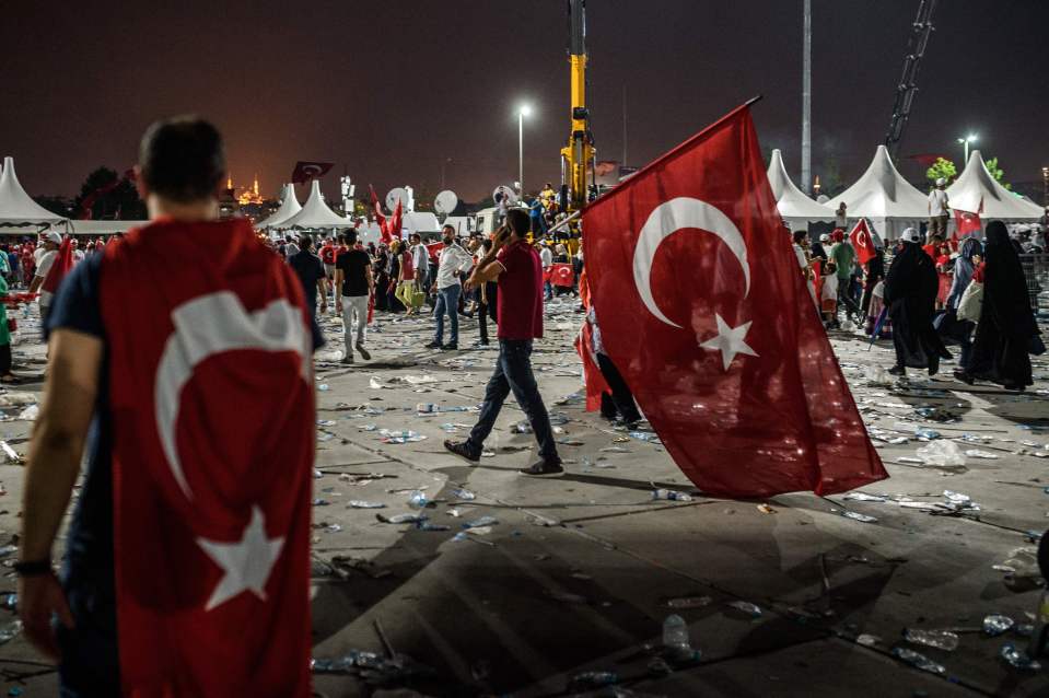 People left the rally at night, taking patriotic flags with them