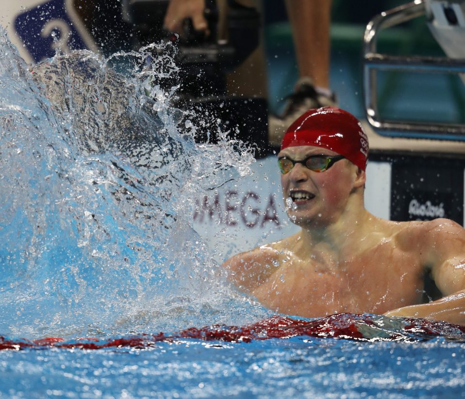 Peaty splashes the water in celebration after seeing his world record time