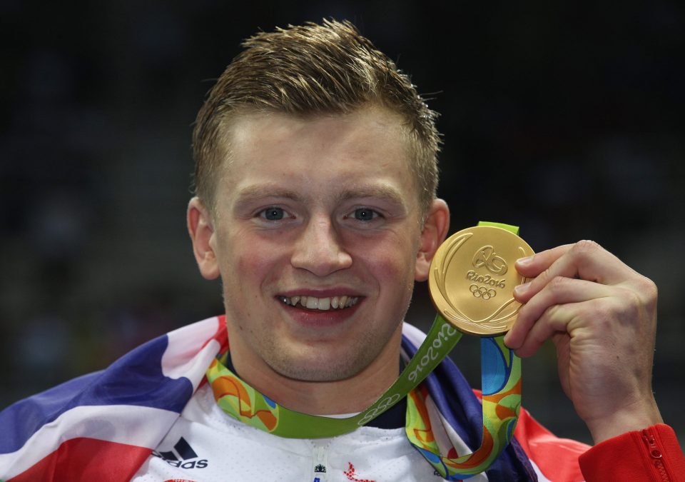Peaty is all smiles as he shows off his gold medal