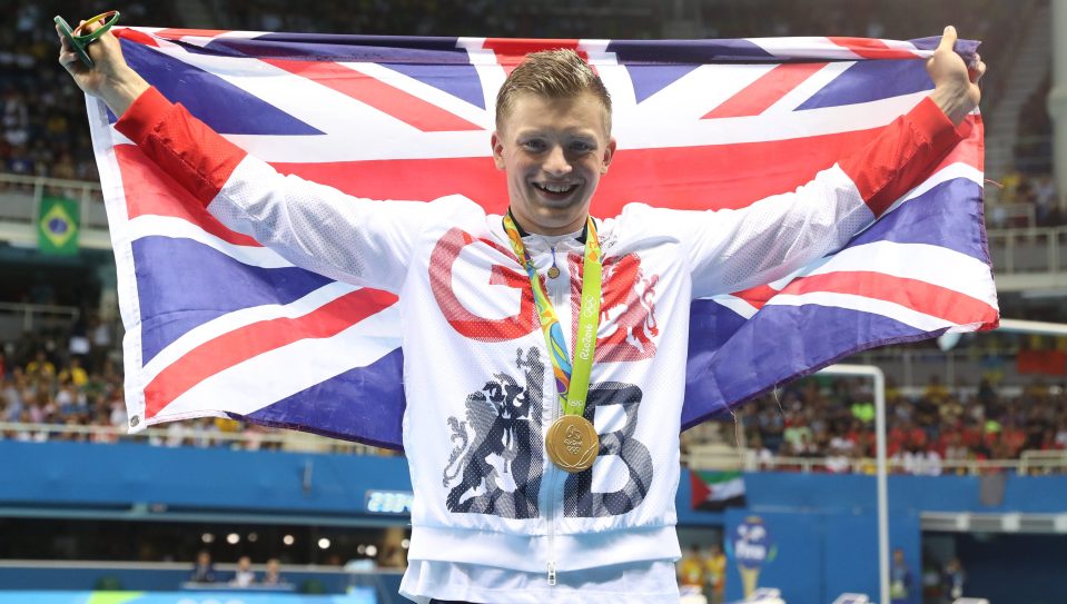 The Brit proudly displays his gold medal after the ceremony in Rio