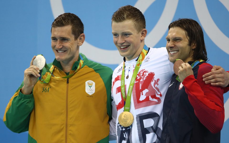 Peaty with silver medalist Cameron van der Burgh of South Africa and bronze winner Cody Miller of the United States 