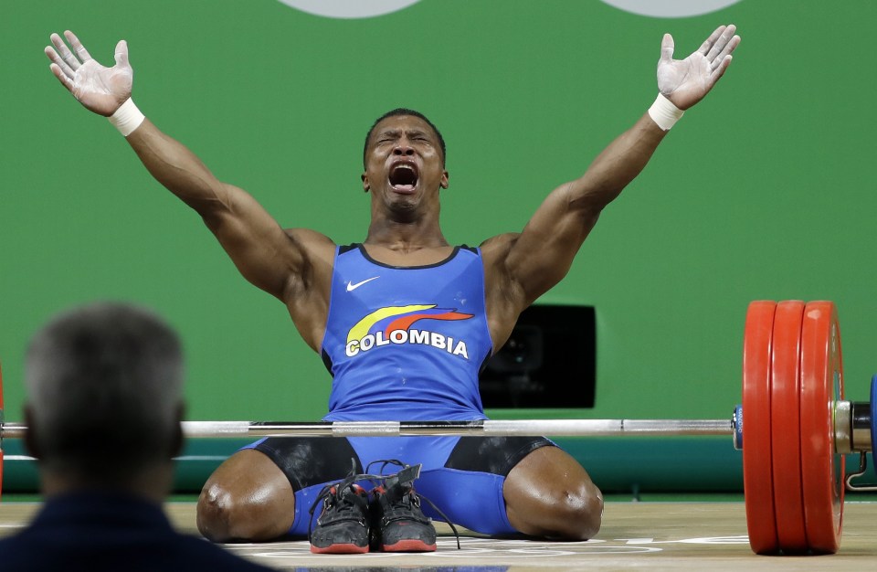 Oscar Figueroa slumps to the ground following incredible, winning lift of 318kg