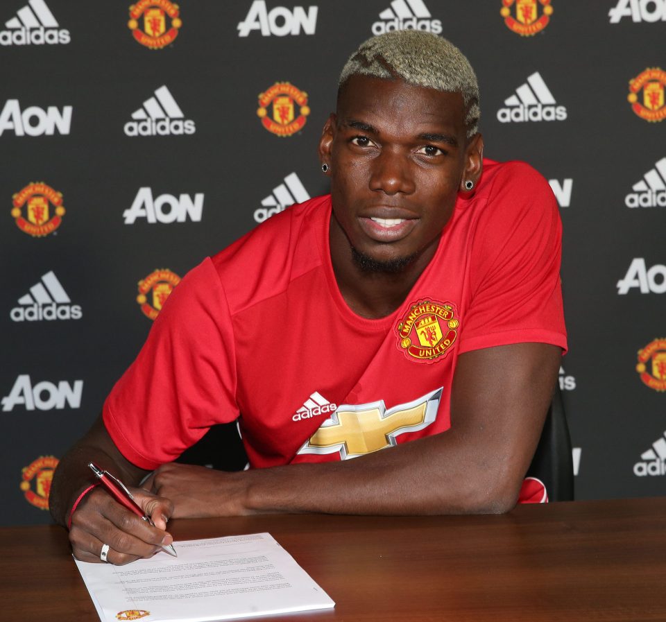 MANCHESTER, ENGLAND - AUGUST 08: (EXCLUSIVE COVERAGE) Paul Pogba of Manchester United poses after signing for the club at Aon Training Complex on August 8, 2016 in Manchester, England. (Photo by John Peters/Man Utd via Getty Images)