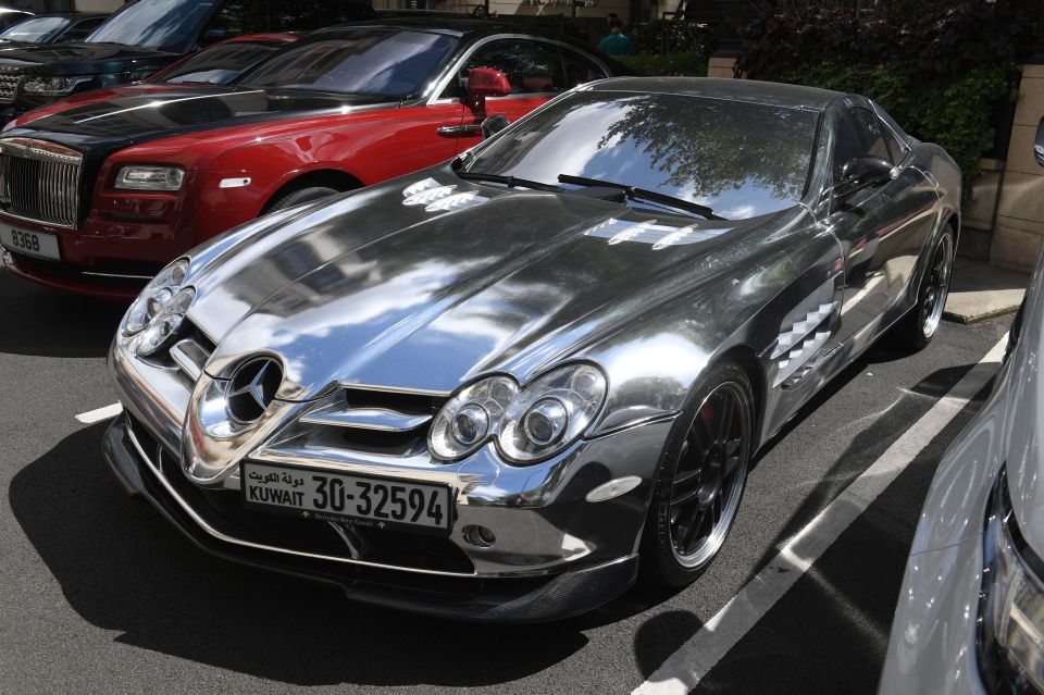 A Mercedes car with a Kuwaiti number plate is parked by The Dorchester Hotel, London