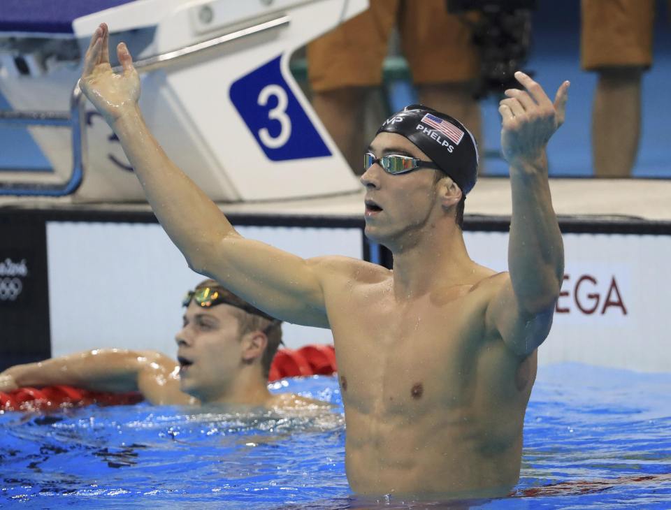 Michael Phelps celebrates after winning his 20th Olympic gold medal