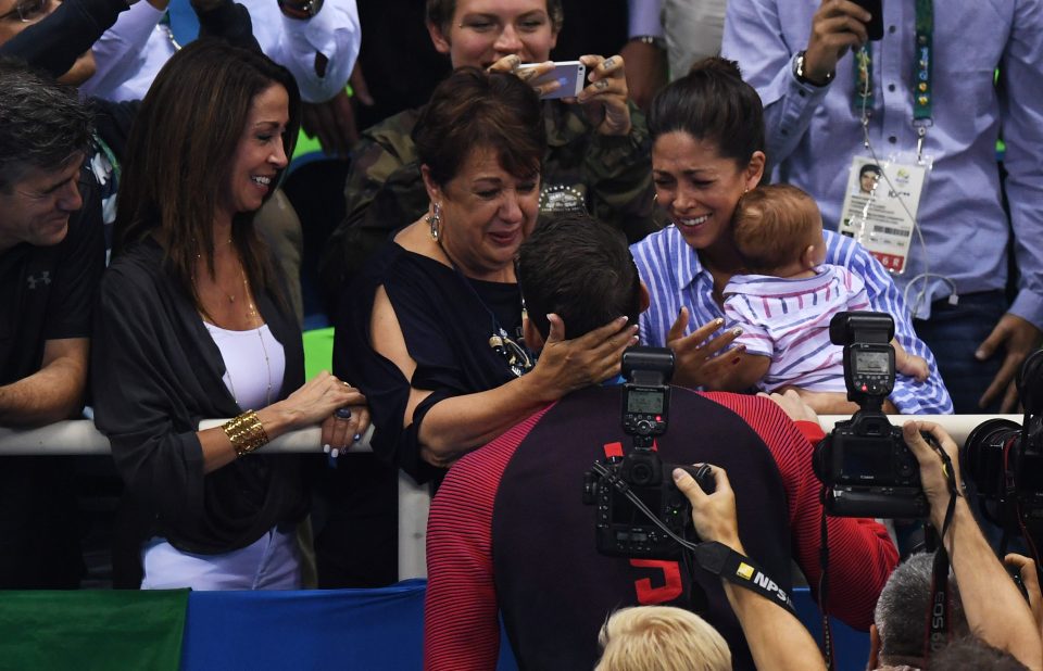 The American great goes to the crowd to celebrate with proud mum Deborah