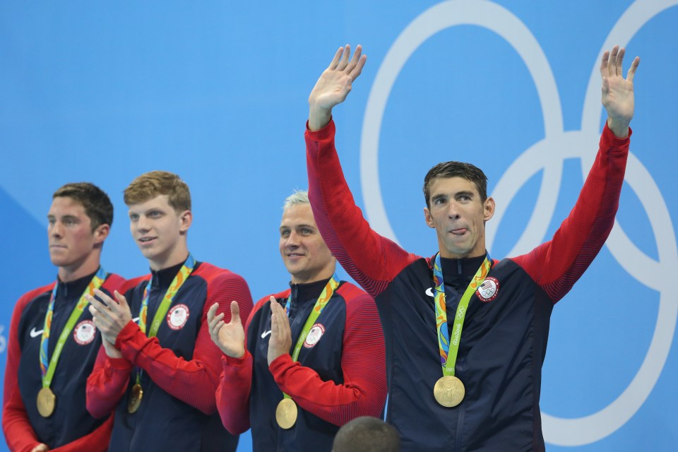 Michael Phelps celebrates winning gold after dominating the 200m freestyle