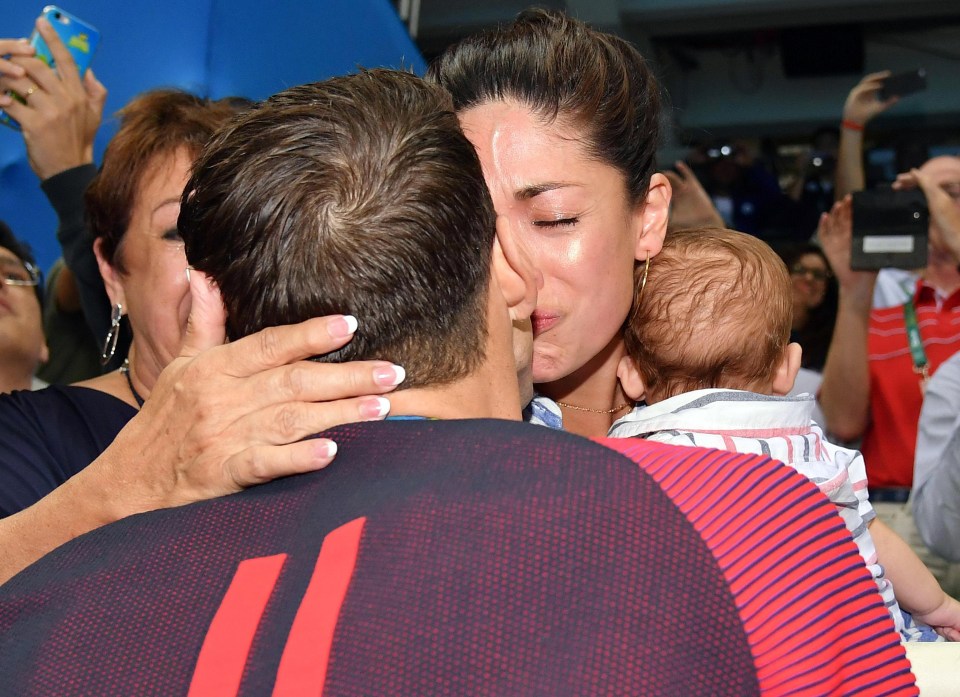 Nicole bursts into tears as her fiance Phelps won the men's 200-metre butterfly