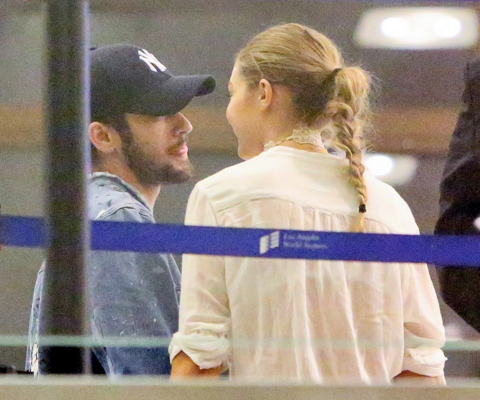 The pair looked all loved up as they chatted at LAX Airport