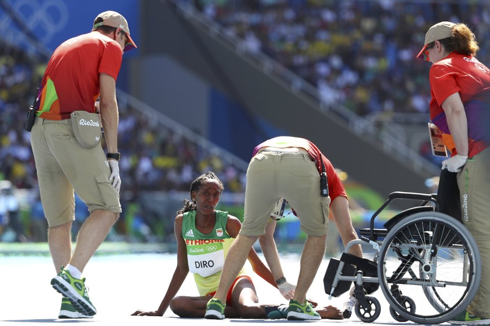Diro is comforted after finishing the race