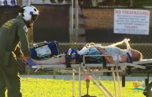 Woman nearly has hand severed by alligator in gruesome attack after dropping a can in the water