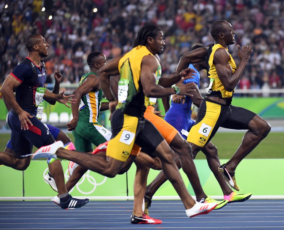 Jamaica's Usain Bolt (R) runs to win the