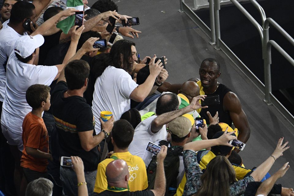 Jamaica's Usain Bolt (R) celebrates with