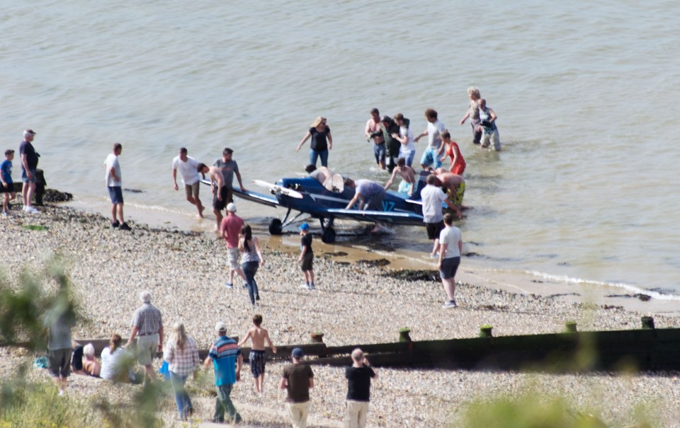 They were then able to haul it over to the shore, before the pilot was rushed to paramedics